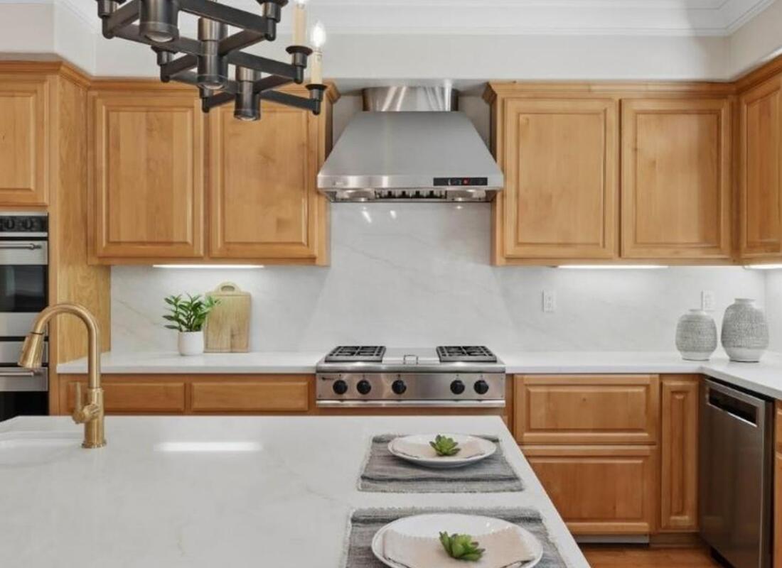 Roseville CA luxury kitchen with quartz island Sub-Zero refrigeration and Monogram appliances