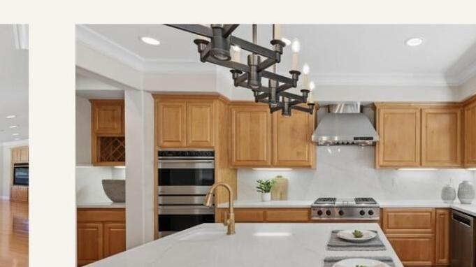 Chef kitchen island with quartz countertops and premium appliances in Roseville CA home