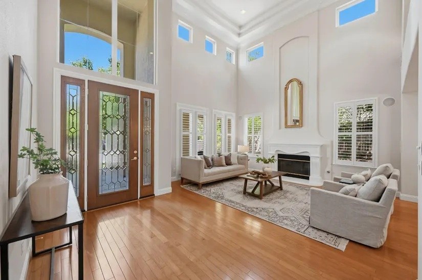 Light-filled living room with soaring ceilings in luxury Roseville CA golf course home